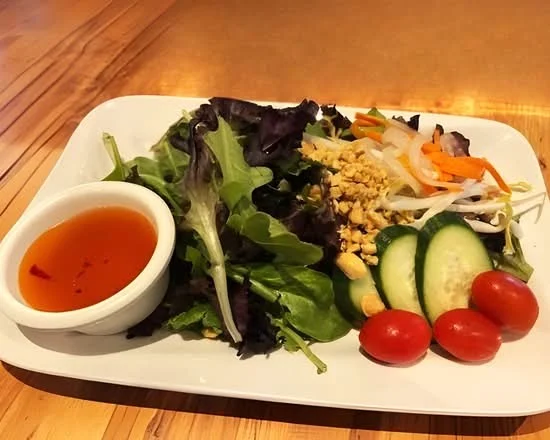 Mixed salad with greens, vegetables and dipping sauce